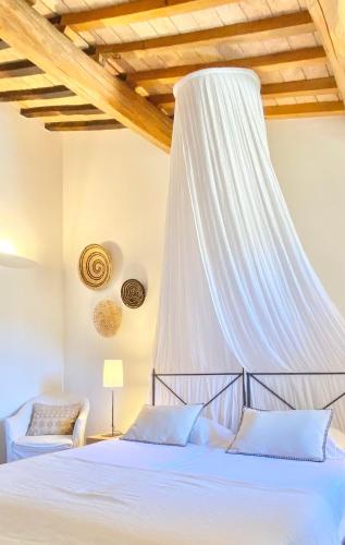 Ένα ή περισσότερα κρεβάτια σε δωμάτιο στο Abbadia Wine Relais