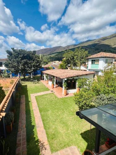 a view of a house with a yard at Pancha Mama Hotel Boutique in Villa de Leyva
