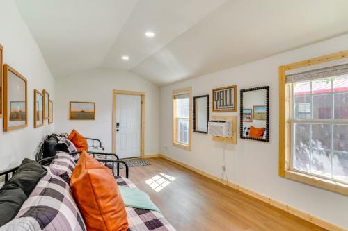 a living room with a couch and a window at Lakefront Graford Home with Fire Pit and Private Dock! in Graford
