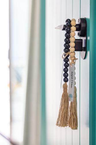 a door knob with tassels on a door at Hotel Boutique Mi Almazara in Jávea