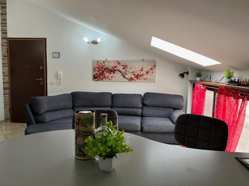 a living room with a couch and a table at La Madama • Casa Vacanze in Porto Torres