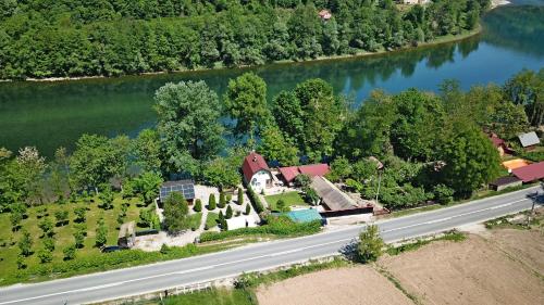 an aerial view of a house next to a river at Kucerak na Drini in Bajina Bašta