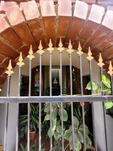 a fence with gold stars on it at Ponni Homestay Kumbakonam in Kumbakonam