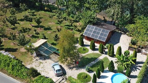 an aerial view of a house with a solar roof at Kucerak na Drini in Bajina Bašta