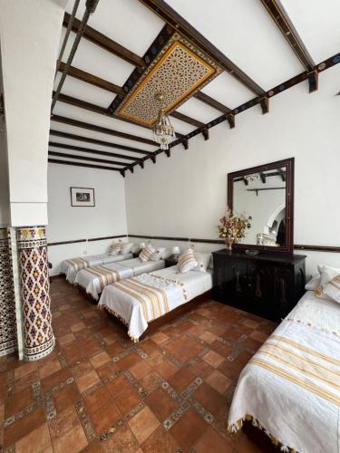 A bed or beds in a room at Dar Al Hurra