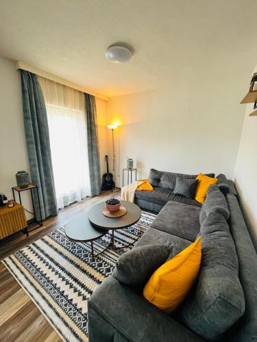 a living room with a couch and a table at Apartment Aleja in Sarajevo
