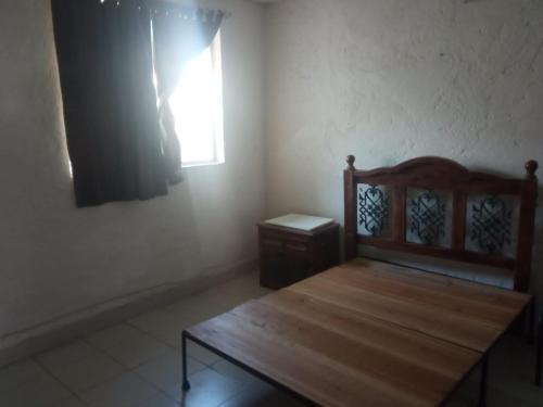 En eller flere senge i et værelse på San Miguel apartments