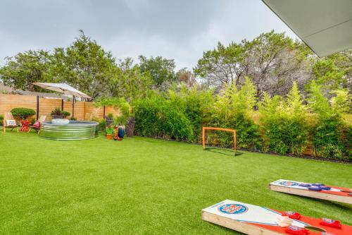a backyard with a soccer ball and a goal at Lago Vista Home with Putting Green, Pool and Jacuzzi in Leander