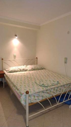 a bedroom with a bed in a room at Leon Studio Komi in Kalamoti