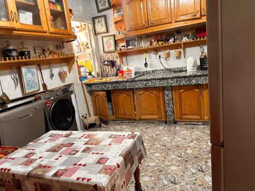 a kitchen with a table with a box on it at Maison wafaa in O Ben Slimane