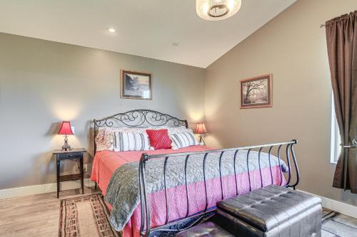a bedroom with a bed and a bench in it at Gorge Retreat - Modern Carson Home with Mtn Views! in Carson