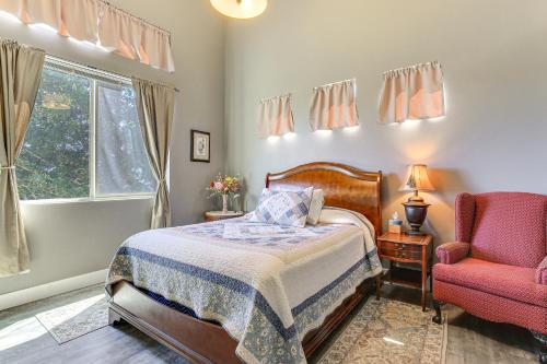 a bedroom with a bed and a chair and a window at Gorge Retreat - Modern Carson Home with Mtn Views! in Carson