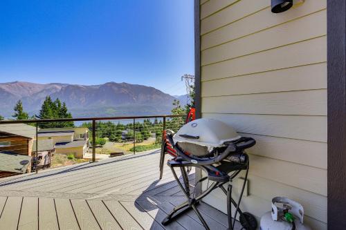 a helmet on a chair on a porch with a view at Gorge Retreat - Modern Carson Home with Mtn Views! in Carson