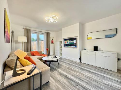 a living room with a couch and a table at Modern 3 Bedroom Home - Free Driveway Parking - 6 Guests - Upstairs Bathroom and Downstairs WC in Armthorpe