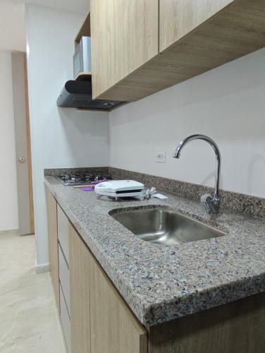 a kitchen with a sink and a counter top at Apartamento Portal 18 in San Alonso