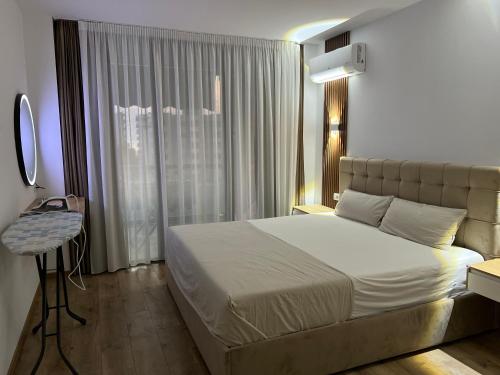 Ένα ή περισσότερα κρεβάτια σε δωμάτιο στο Learts Apartment Shengjin