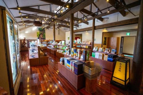 a book store with several shelves of books at Jomon no Yado Manten in Yakushima