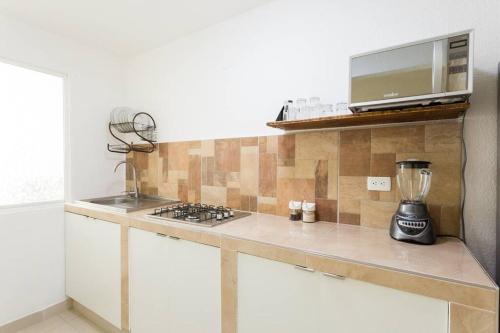 a kitchen with a counter with a blender on it at M&Z Loft Las Palmas in Cancún