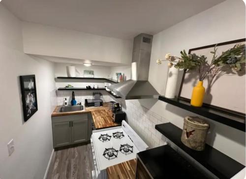 a small kitchen with a stove and a sink at Nationwide Childrens Hospital close by in Columbus