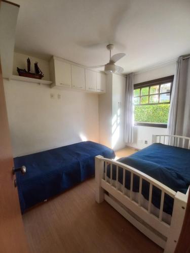 En eller flere senge i et værelse på Pacote 3 dias Apto Térreo Rock The mointain Itaipava