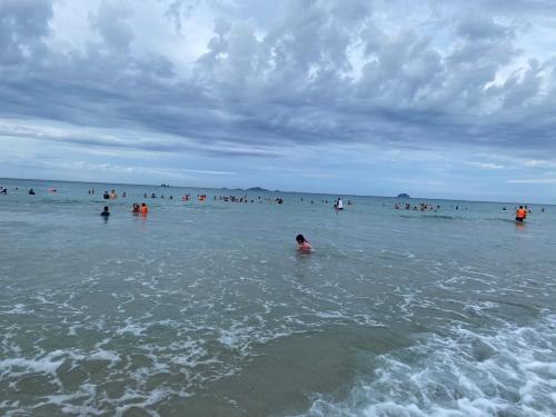 a group of people in the water at the beach at Arena Bãi Dài Cam Ranh Khánh Hoà in Cam Ranh