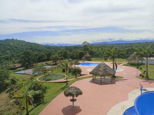 an aerial view of a resort with a pool at Casa Campestre Wasi loma in Pedro Vicente Maldonado