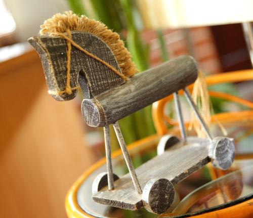 a model of a wooden toy airplane on a table at Alpinist Hotel in Bishkek
