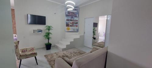 TV a/nebo společenská místnost v ubytování Pousada Luz do Sol