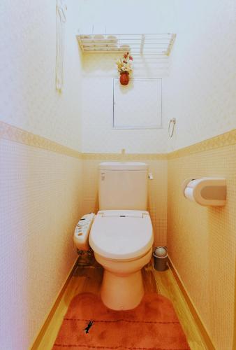 a bathroom with a white toilet in a room at ABC Guest House 2F in Izumi-Sano