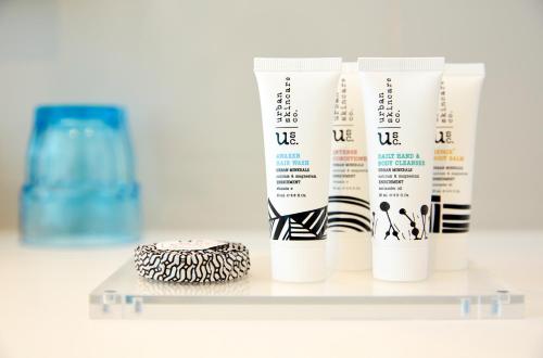 a shelf with four tubes of moisturizing moisturizers at Holiday Inn Express Adelaide City Centre by IHG in Adelaide
