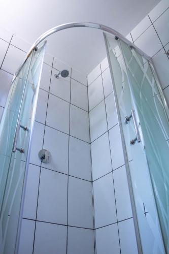 a shower in a room with a glass wall at La Chacana Hotel Boutique in Huaraz