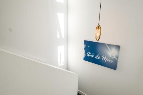 a room with a picture on a wall at Casa Aire de Mar, modern house with private pool, overlooking Baviera golf, within walking distance of beach in Vélez-Málaga