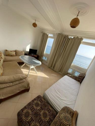 a large living room with a view of the ocean at Mouja Taghazout in Taghazout