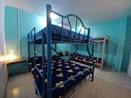 Postel nebo postele na pokoji v ubytování Cebu City Unit2 Spacious 2BR near SM Seaside NuStar Ocean Park Dynamic Herb Anjo