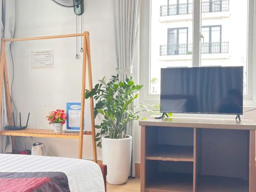 TV a/nebo společenská místnost v ubytování Fortuna Homestay
