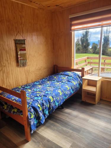 Кровать или кровати в номере Cabaña vista hermoza aldachildo
