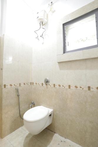 Koupelna v ubytování Hi5 Hotel Aryan