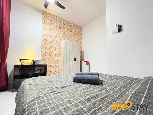 a bedroom with a large bed and a desk at Youth City Residence Family Suite KLIA AEON Mall Nilai USIM in Nilai