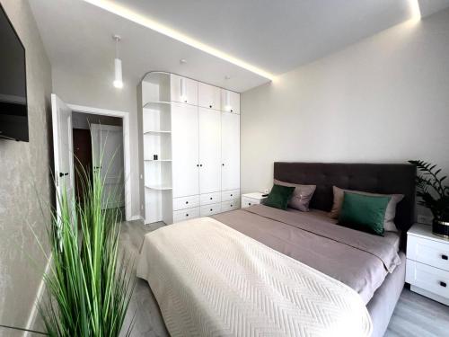 Кровать или кровати в номере Apartments VIP AVALON