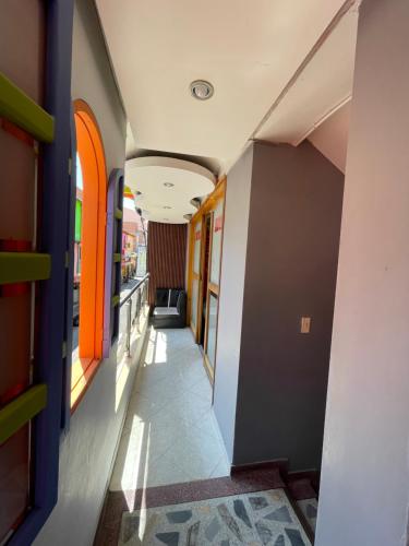 a corridor of a building with a hallway at Hotel Las Vegas in Guatapé