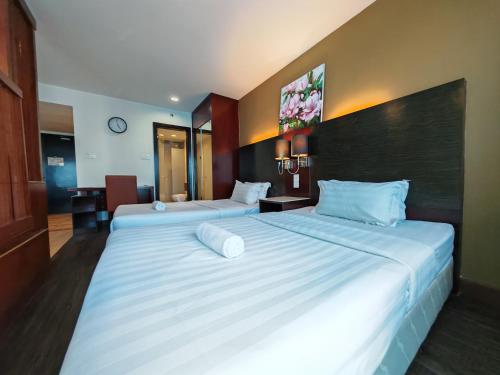 Katil atau katil-katil dalam bilik di Meetsuite at Ming Garden Residence