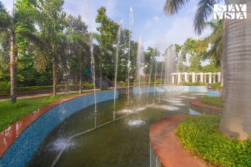 a rendering of a water fountain in a park at StayVista at Wandering Vines 4BHK with FREE Breakfast ,Indoor Pool in Delhi Sohna in Sohna