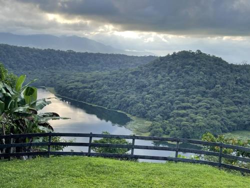 a view of a river with mountains in the background at Volcan Hule Lodging in Río Cuarto