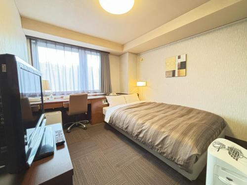 Postel nebo postele na pokoji v ubytování Hotel Route-Inn Ueda -Kokudou 18 Gou-