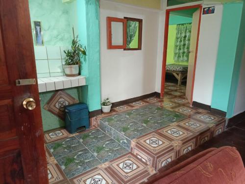 a room with a tiled floor in a house at Las vegas lodge and restaurant in Banaue