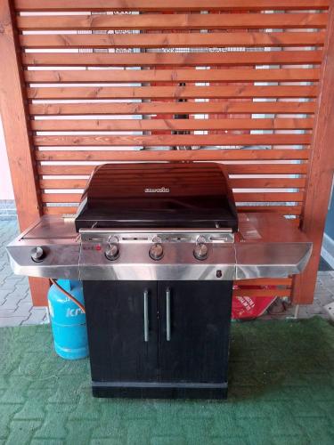 a grill sitting in front of a bench at Hotel Fabrica in Liberec