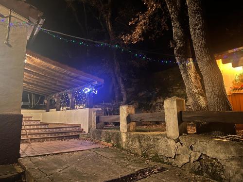 a set of stairs with a tree and lights at Casa rural en plena naturaleza Lic UVTR1524 in Eguíllor