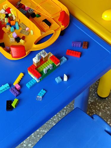a table with legos and a toy car on it at Artyzen Habitat Hengqin Zhuhai in Zhuhai