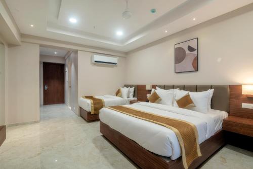 Giường trong phòng chung tại VITS Satyajeet Karad
