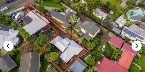 an aerial view of a residential neighborhood with houses at Modern Central Auckland in Auckland